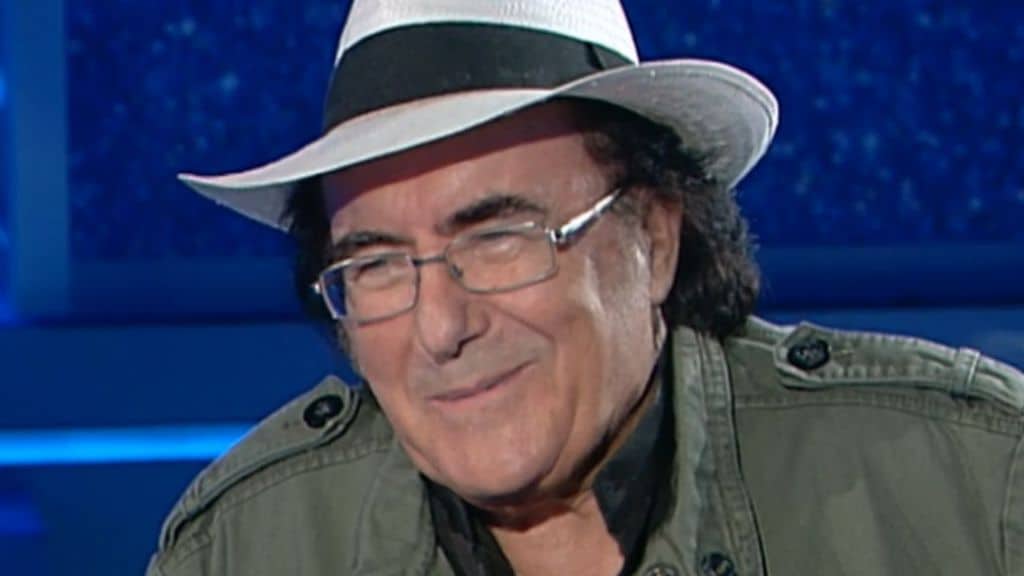 mezzo busto di al bano seduto in poltrona