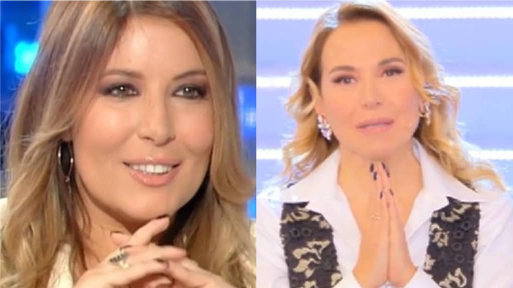 lucarelli e barbara d'urso con le mani a preghiera